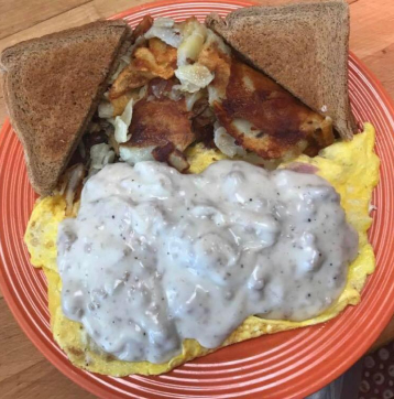 Creamed mushrooms over eggs with toast